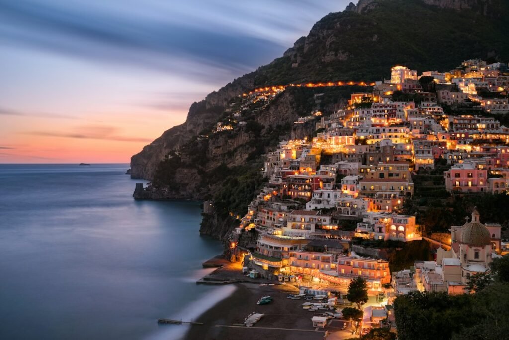 7-Day Amalfi Cruise & Rome Escape - Positano illuminated at night on the Amalfi Coast