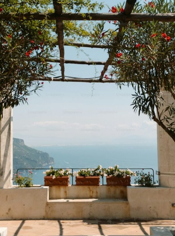 10-Day Rome, Amalfi Coast & Sicily Discovery - Ocean view through a stone archway