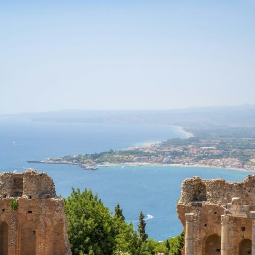 20-Day Grand Italy Cruise & Land Discovery - City and ocean view from Taormina