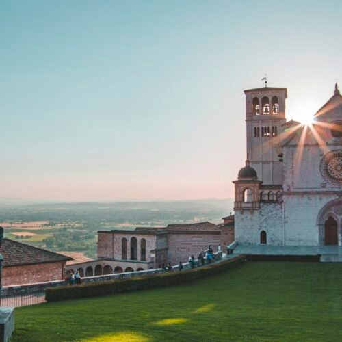 Assisi & St. Francis Heritage Pilgrimage - Assisi hilltop building near green fields