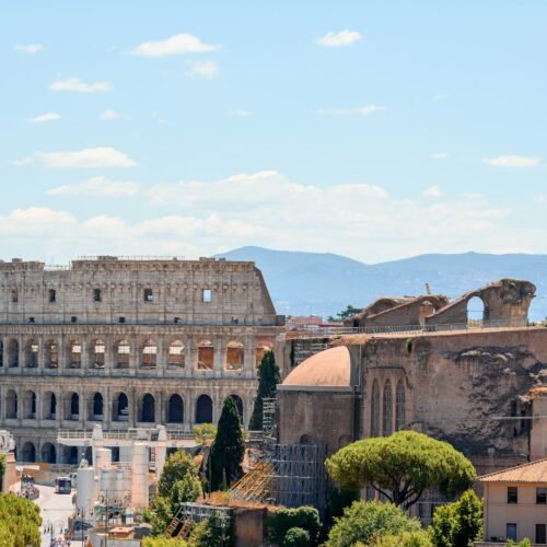 Ancient Rome in a Day — Complete Experience - Historic Rome building with statue