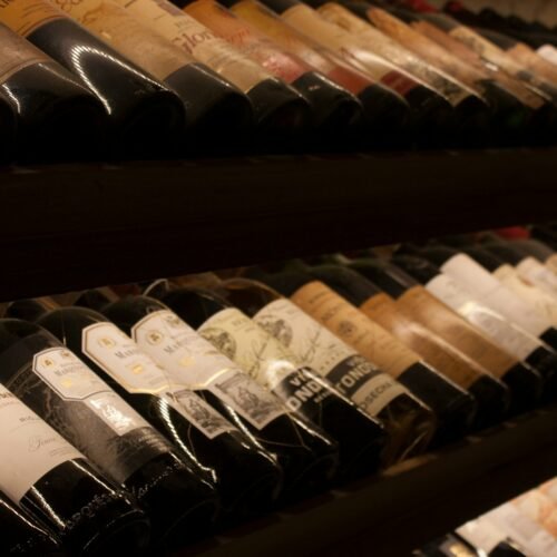 Food Tasting in a Historic Roman Cellar - Wine bottles on a cellar shelf
